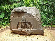 Altar 5 from La Venta. The inert were-jaguar baby held by the central figure is seen by some as an indication of child sacrifice. La Venta Altar 5 (Ruben Charles).jpg