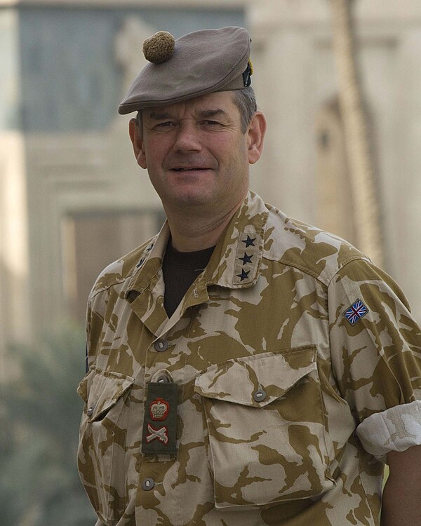 Lieutenant General John Cooper wearing both American three-star insignia and British lieutenant general insignia