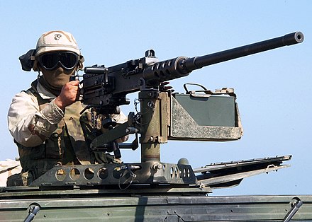 A U.S. Marine mans a .50 caliber machine gun as part of a security force during a training exercise with the 24th Marine Expeditionary Unit in November 2002.
