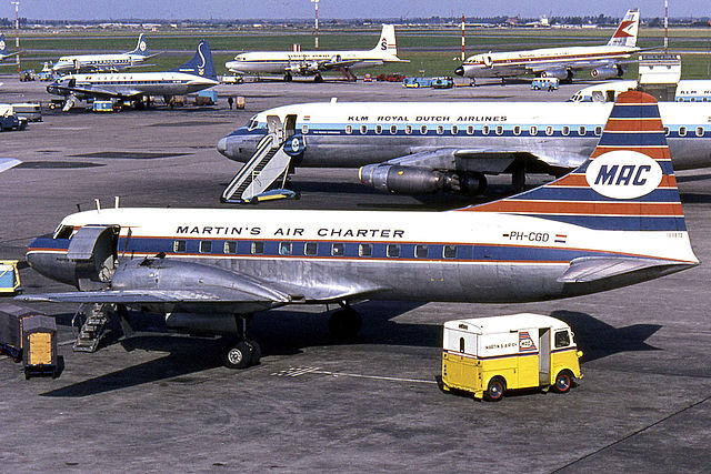 Airplanes and service vehicles on the apron in 1965