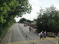 Fairlee Road, Newport, Isle of Wight photographed during the Isle of Wight Festival 2010. As can be seen, the road has been restricted to only allow traffic towards Newport due high pedestrian numbers walking towards the Festival site over the weekend, causing buses and other vehicles to be diverted along other roads. After the end of each act on the night the road is closed in both directions.