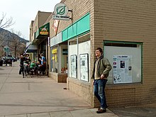 One-story brick building with a sign reading 