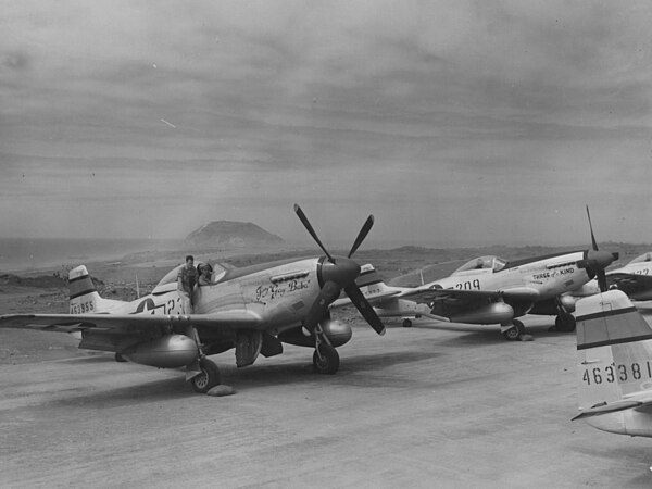 P-51Ds of the 21st Fighter Group at North Field, Iwo Jima 1945, Note Mount Suribachi in the background.