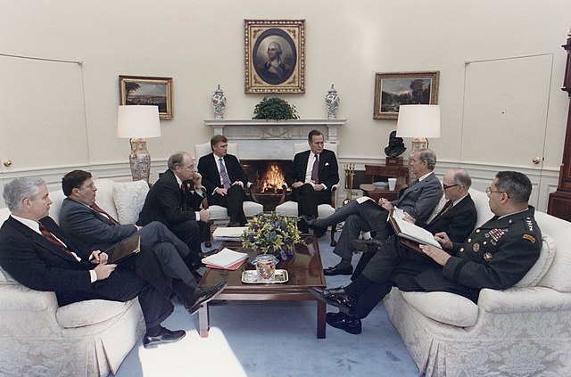 President George H. W. Bush meets in the Oval Office with his NSC about Operation Desert Shield, 1991