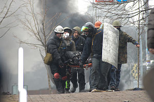 Protesters transporting wounded from the field. Clashes in Kyiv, Ukraine. Events of February 18, 2014.jpg