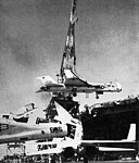 RA-5Cs RVAH-13 being hoisted on USS Kitty Hawk (CVA-63) 1965.jpg