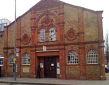 Drill Hall built in 1898 for some of the batteries of the 1st London Artillery Volunteers, Shepherd's Bush, London. Later used by the 7th London Brigade, Royal Field Artillery (TF) Shepherds Bush Hall.jpg