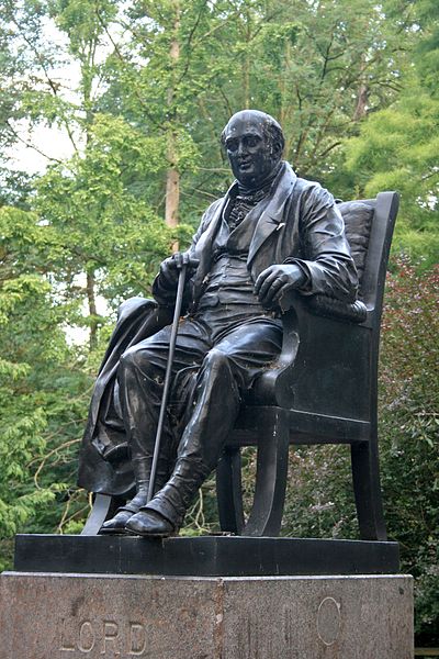 Lord Holland's statue rises from a pond in Holland Park, London.