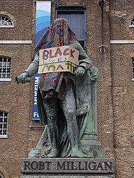 Statue of Robert Milligan, West India Quay on 9 June 2020 - statue covered and with Black Lives Matter sign 03.jpg