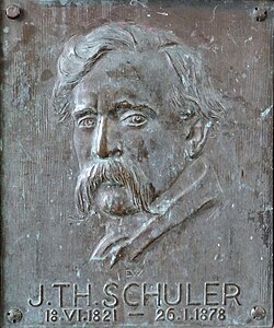 Attribué à Ernst Weber, Théophile Schuler, bas-relief ornant le piédestal de la Statue du Meiselocker (1910), Strasbourg, place Saint-Étienne.