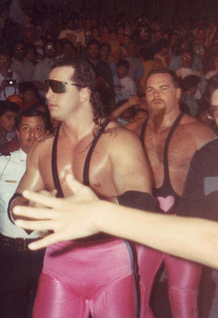 Hart (left) with Jim Neidhart behind him as The Hart Foundation