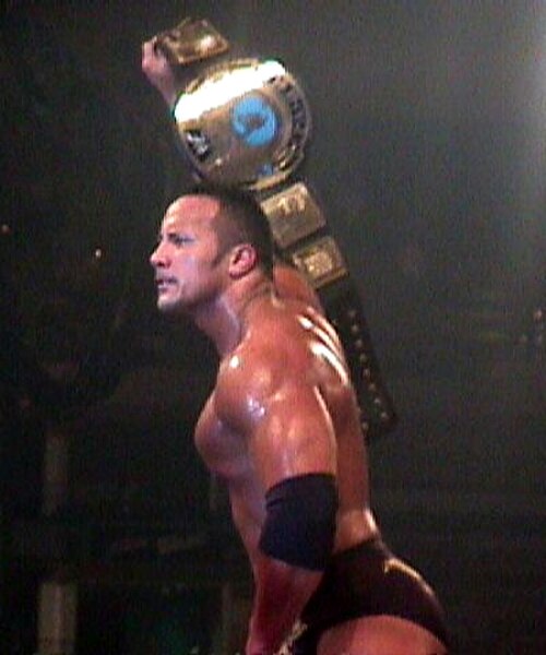 The Rock as the WWF Champion in 2000. Also considered by some to be the face of the Attitude Era.