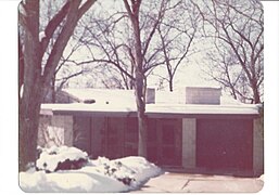 Street-view, circa 1965, showing the shagbark hickory tree growing through the notch in the roof. The tree was later removed for safety reasons.