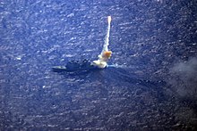 A RIM-161 Standard missile leaves the Lake Erie en route to intercept a short-range ballistic missile launched from Barking Sands Pacific Missile Range Facility, Kauai, Hawaii USS Lake Erie (CG-70) aerial.jpg