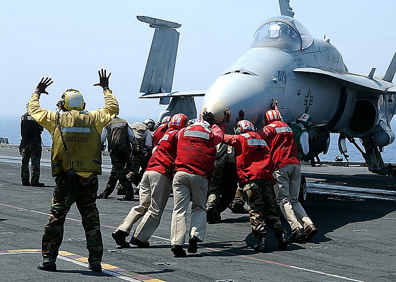 File:US Navy 020711-N-2329T-002 Sailors "push back" an F-A-18 "Hornet" strike fighter aircraft.jpg