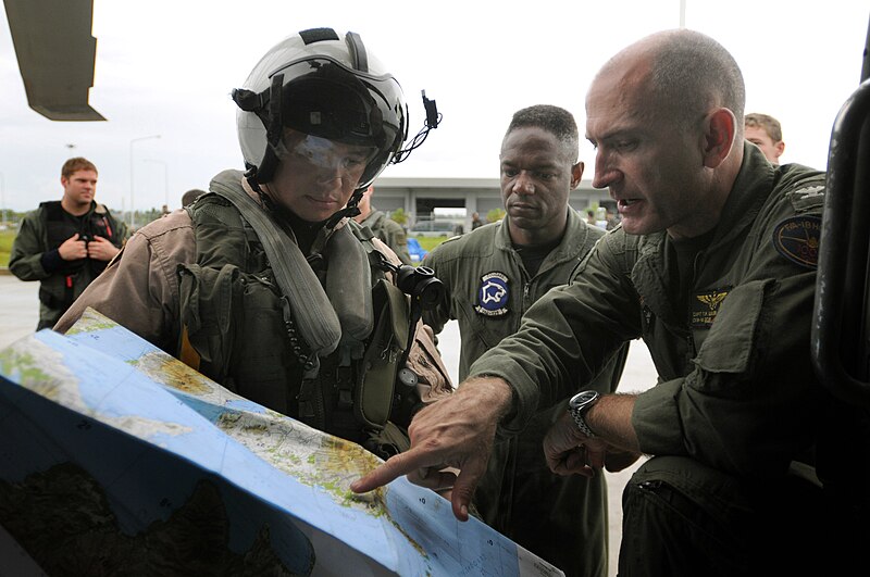 File:US Navy 080626-N-5961C-012 Capt. Thomas P. Lalor, right, deputy commander, Carrier Air Wing (CVW) 14, gives Lt. Ralph Silvas directions to the area he is to deliver humanitarian supplies to on Panay Island.jpg