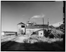 Baroid Clay Spur Bentonite Mill, Clay Spur Siding, 1989. This plant opened in 1928 and closed in the 1970s. VIEW OF REFINING MILL, LOOKING SOUTH-SOUTHEAST - Clay Spur Bentonite Plant and Camp, Refining Mill, Clay Spur Siding on Burlington Northern Railroad, Osage, Weston County, WY HAER WYO,23-OSAG.V,1-O-12.tif