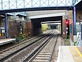 The West London Line passing under Lillie Bridge towards Kensington (Olympia) station