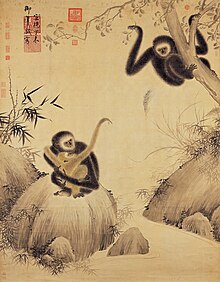 Obraz gibbonů, uprostřed na kameni matka držící v náručí mládě, vpravo další gibbon sedí na větvi.