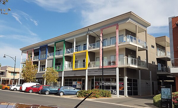 Mixed-use buildings, such as this one on Goodall Parade, are a feature of the Mawson Central business district. Apartments occupy the upper floors, wi