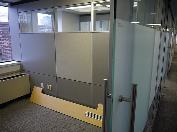 Demountable wall and door in an office building