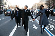 President Barack Obama and First Lady Michelle Obama walking in the inaugural parade following the public inauguration at the United States Capitol building. Barack Obama and Michelle Obama in inaugural parade 01-21-13.jpg