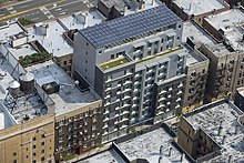 An apartment with a pergola and solar panels in the Bronx, New York City Brocker 000308 173001 518483 4578 (36776424576).jpg