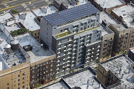 An apartment with a pergola and solar panels in the Bronx, New York City