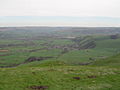 View of the village of Castleton from Mam Tor with Hope cement works in the background