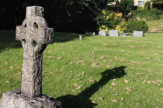 Celtic cross casting its shadow at St Andrew's Church, Kegworth