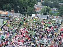 Meath supporters (green and yellow) at an All-Ireland Qualifiers game against Tyrone. Croke Park fans on the hill.jpg