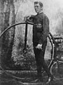 Cyclist posing with a penny farthing bicycle, Queensland (3347794249).jpg