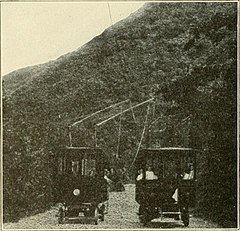 Trolley buses passing each other on Laurel Canyon Drive. The bus on the right is coasting downhill with its trolley poles down.[13][14][15][16][17][18]