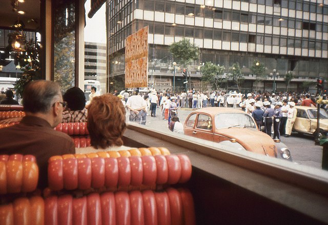 Customers at Denny's Restaurant watch May Day Demonstration-Protests. Meksiko, Mexico, May 1, 1989
