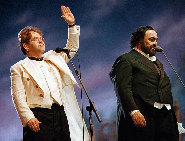 Elton John with Luciano Pavarotti during the 1996 Pavarotti & Friends concert for War Child in Modena, Italy