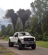 Monster truck rolling coal