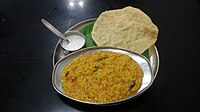 Bisi bele bhaath served with raita and Happala(papad)