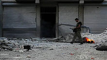 Un combattant de l'Armée syrienne libre, dans les rues d'Alep. Octobre 2012
