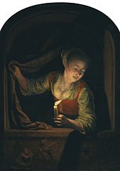 Young Woman with a lighted Candle at a Window