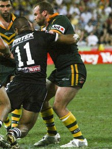 Stewart playing for the Kangaroos in 2008 Glenn Stewart wrestles with the Kiwis.jpg