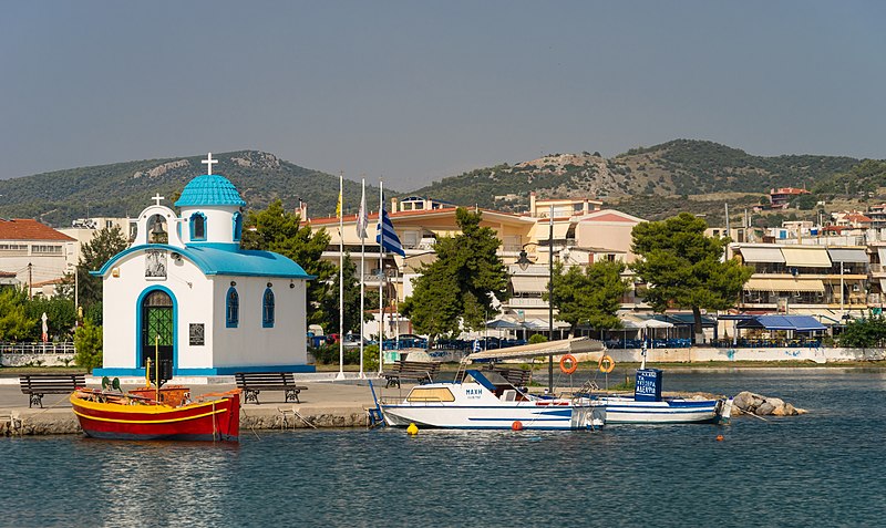 File:Harbour chapel, red boat, Nea Artaki, Evia Greece.jpg