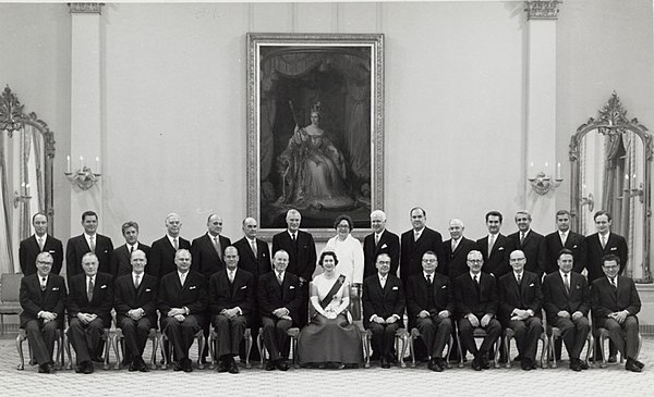Elizabeth II, Queen of Canada, with her Cabinet, chaired by Prime Minister Lester B. Pearson, part of the 19th Canadian Ministry (Elizabeth's third), 