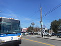 A sign for the diner, which is nearly obstructed by this MTA Express Bus.