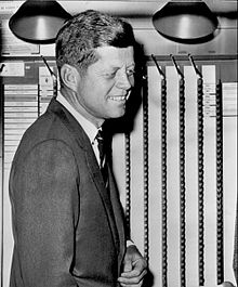 Kennedy casts his ballot at his polling place at a branch of the Boston Public Library. John F. Kennedy voting 1960.jpg