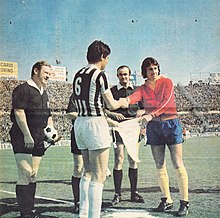 McFarland (right) captaining Derby County in 1973, here with Salvadore of Juventus before the semi-final round of the European Cup in Turin, Italy. Juventus v Derby County 1973-04-11 pre-game ceremony.jpg