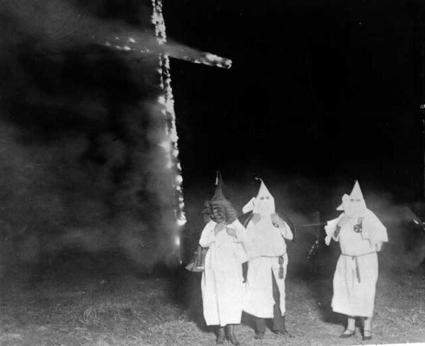 Cross burning by Ku Klux Klan members in 1921