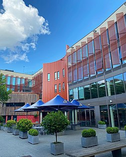 Lord Ashcroft Building, seat of the business school, as seen from inside the campus in Cambridge, Cambridgeshire. Lord Ashcroft Building at ARU Cambridge.jpg