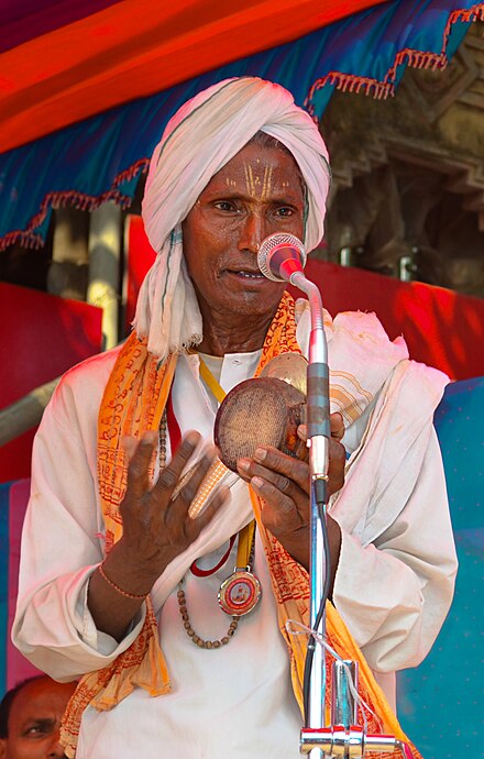 Man playing Khanjani during the Rukuna Ratha Jatra of Lingaraja, Bhubaneswar, Odisha