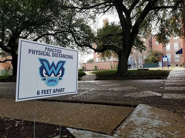 Physical distance sign behind Callaway Hall