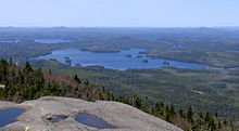 Middle Saranac Lake from Ampersand Mountain, Upper Saranac Lake, upper right, Weller Pond, center right Middle Saranac Lake from Ampersand.jpg